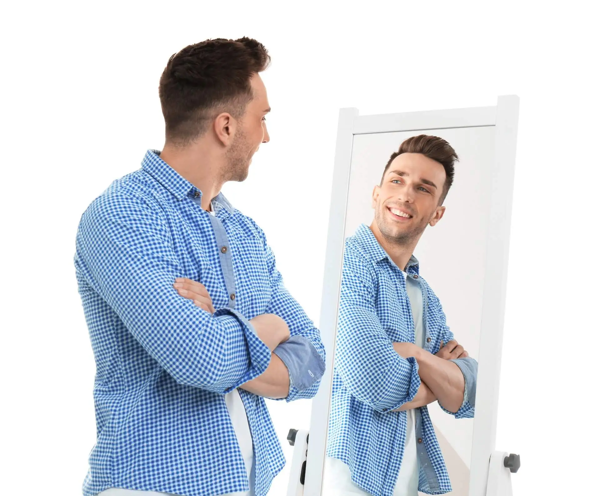 Man looking at a mirror and smiling | Image of the Hypnotherapy for Confidence and Self Esteem page.